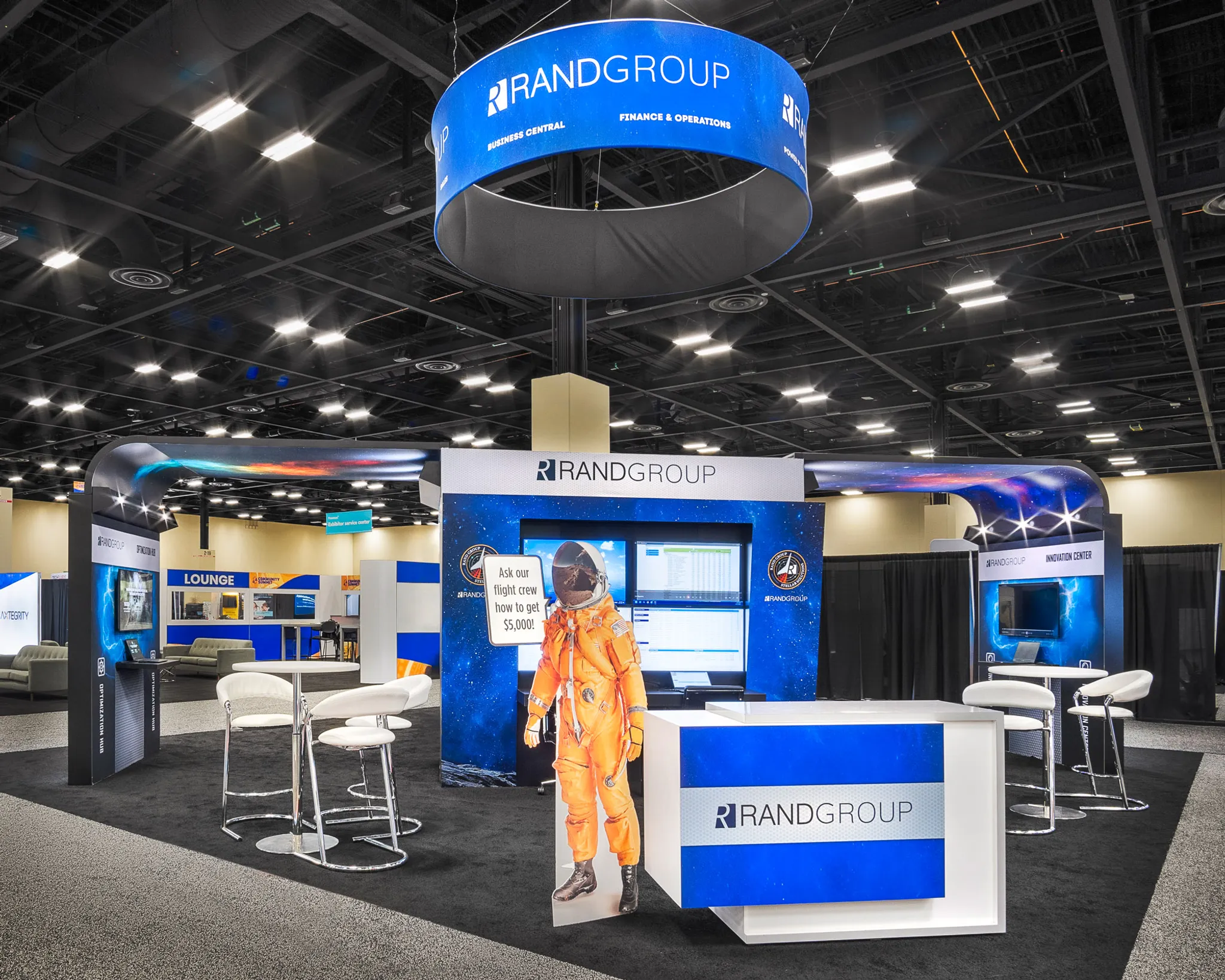 Art & Display 20x20 trade show booth with stool and meeting tables