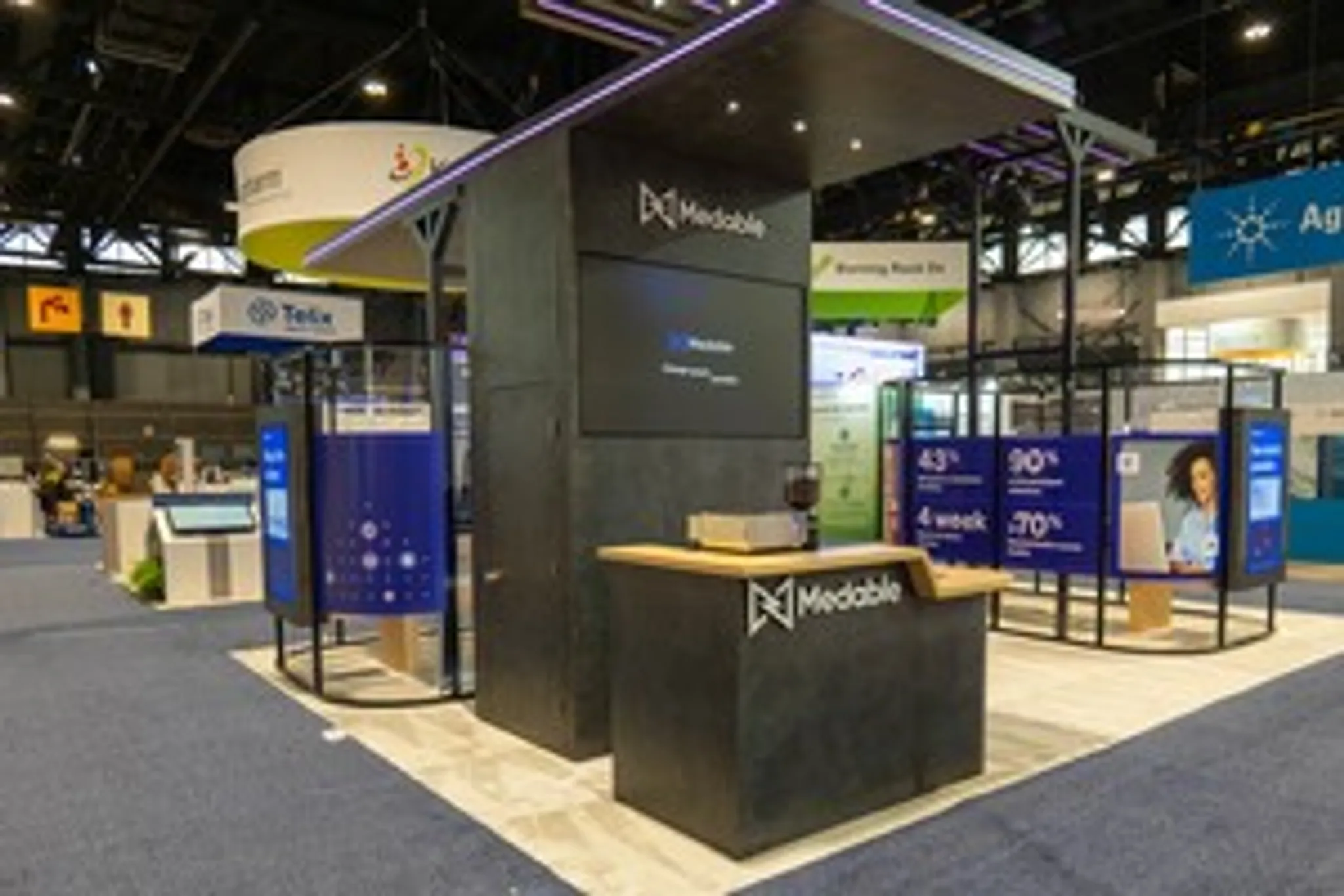 30x30 Island booth design by Absolute Exhibits