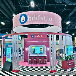 20x20 Island booth design by Highway 85 Creative
