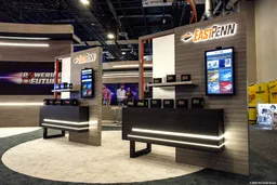 20x20 Peninsula booth design by The Trade Group